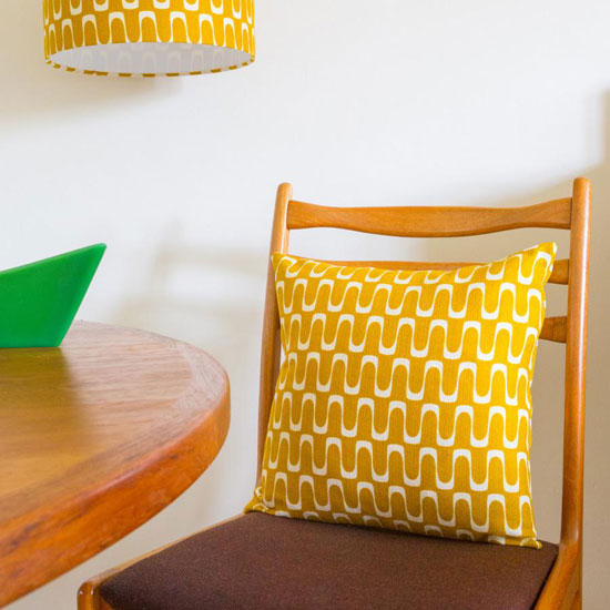 Retro-style barkcloth table lamps and cushions at Hunkydory Home