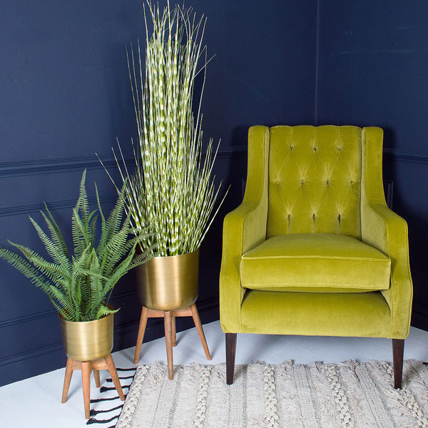 Midcentury-style brass planters at Audenza