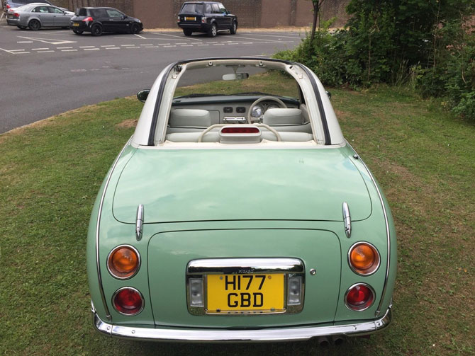 Nissan Figaro in emerald green on eBay