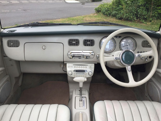 Nissan Figaro in emerald green on eBay